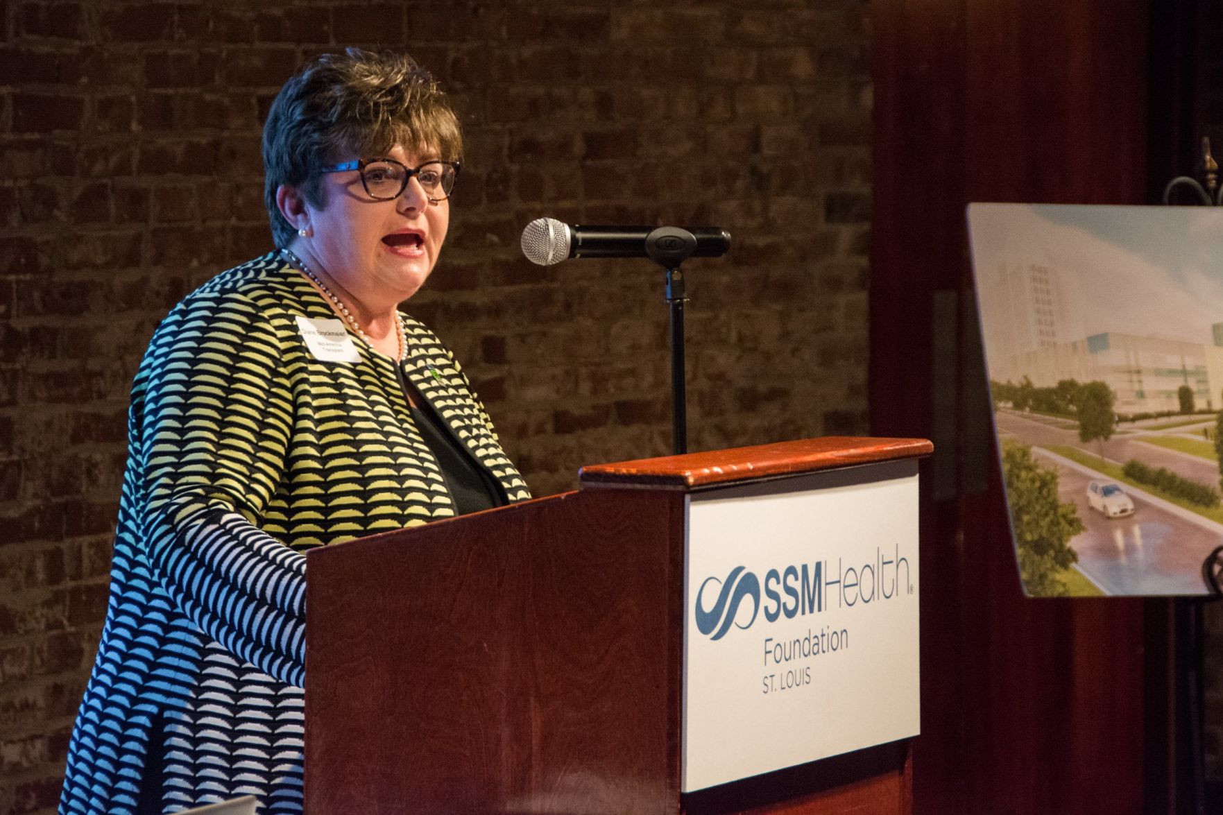 Diane Brockmeier, President and CEO of Mid-America Transplant speaks at the event
